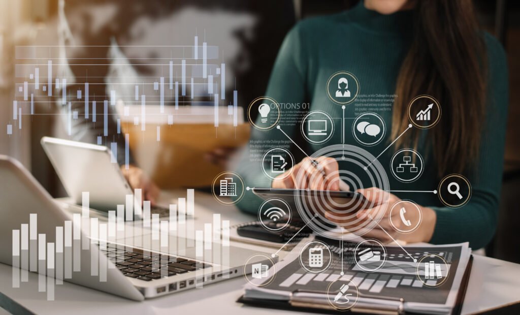 Floating business icons overlaid on woman working